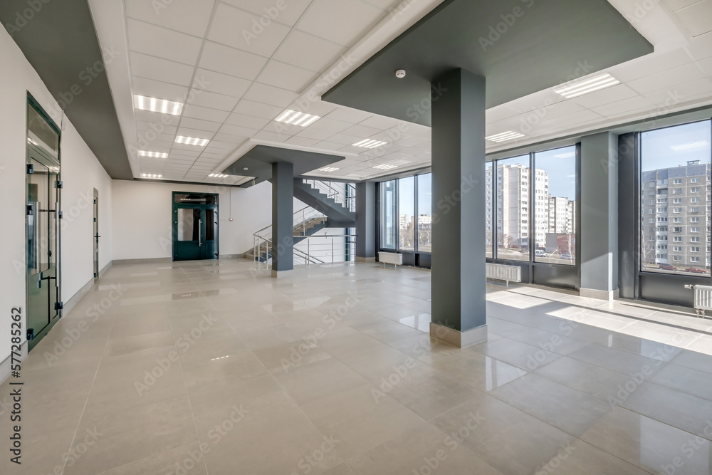 Fototapeta premium empty modern hall room with columns, doors and panoramic windows