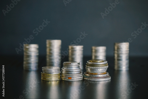 Stack of silver money coins on the table