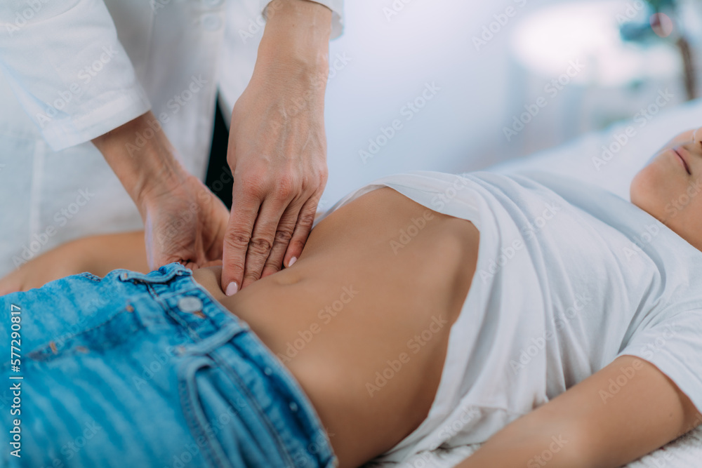 Fototapeta premium Pediatrician Gastroenterologist, Examining Boy’s Abdomen
