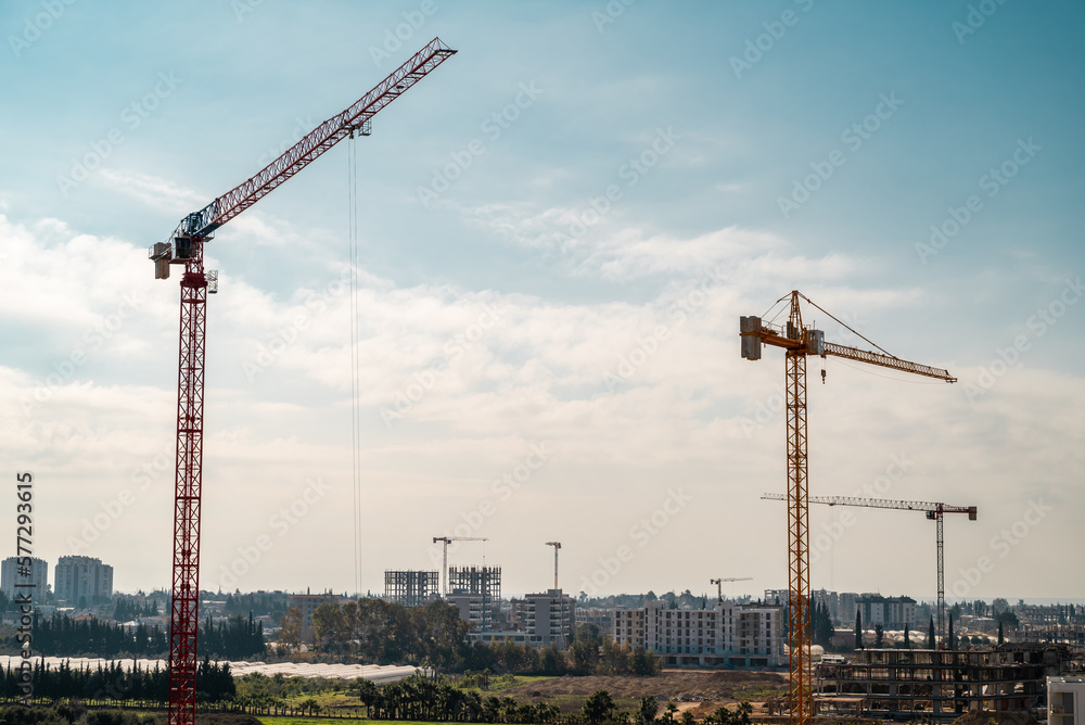 Construction crane working on large construction site