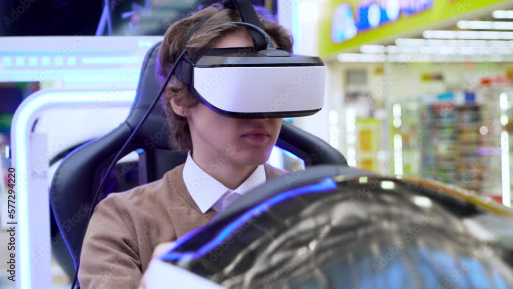 Man wearing virtual reality glasses play online video game with car simulator Man wearing virtual reality glasses play online video game with car simulator