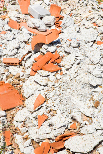 Concrete and brick rubble debris on construction site after a de photo