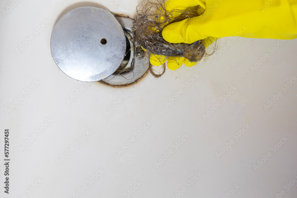 Shower drain is clogged with hair, Hair pile loss in a bathroom after