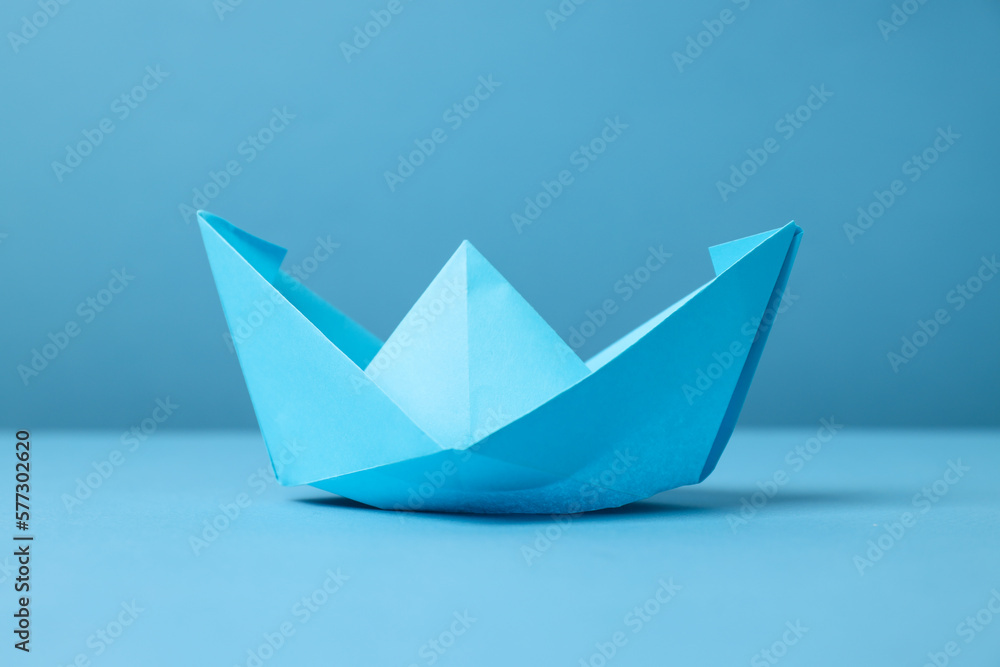 Concept of travel and adventure with paper boat Concept of travel and adventure with paper boat