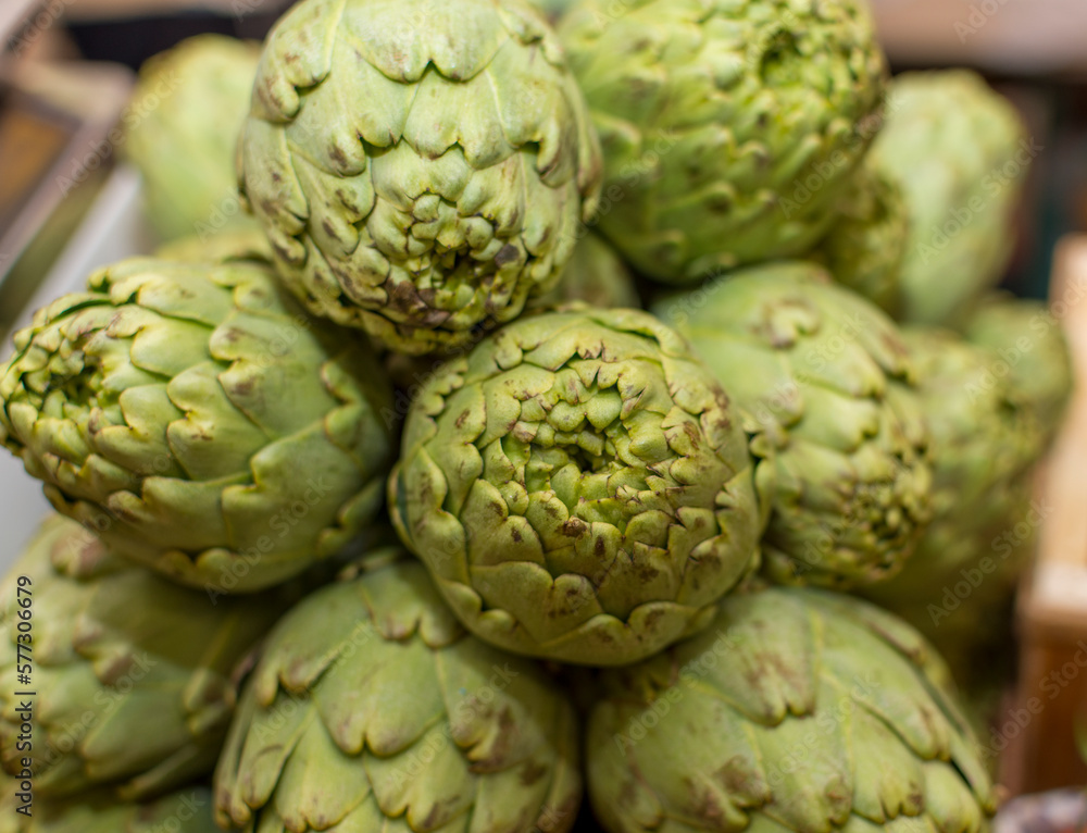 A bowl of artichokes with the word artichoke on it