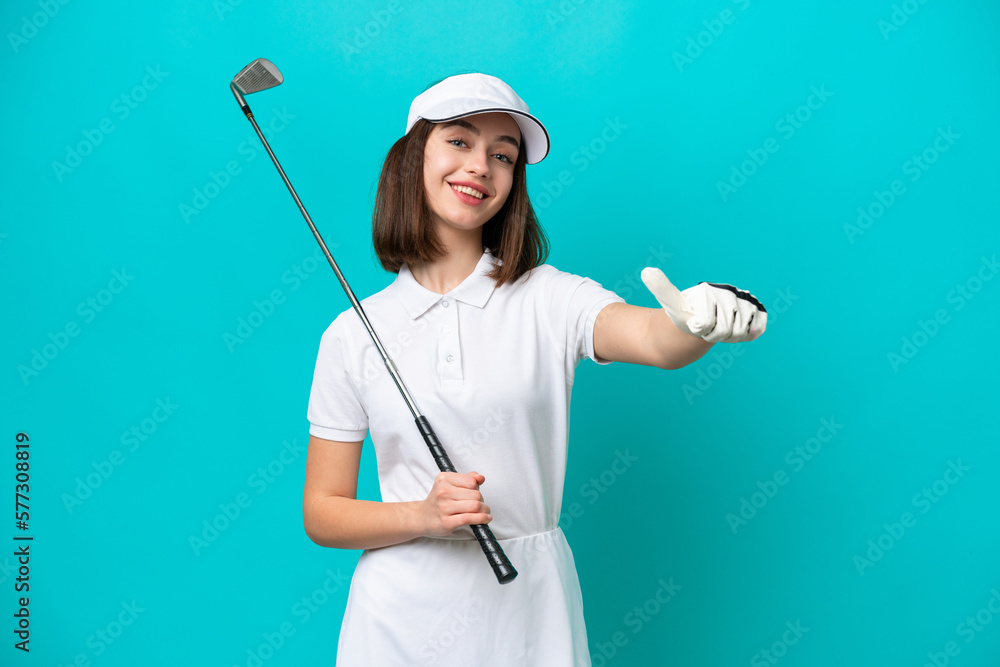 Young Ukrainian golfer player woman isolated on blue background giving a thumbs up gesture Young Ukrainian golfer player woman isolated on blue background giving a thumbs up gesture