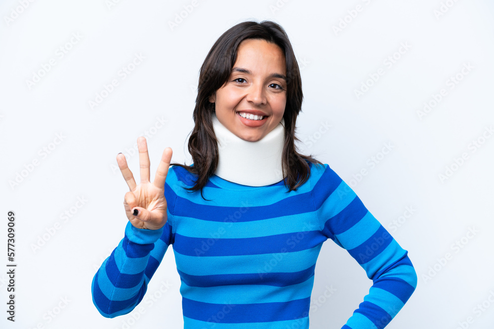 Young hispanic woman wearing neck brace isolated on white background happy and counting three with fingers