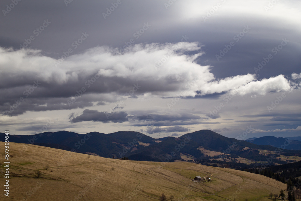 Steep mountain slope in Carpathians landscape photo. Nature scenery photography with cloudy sky on background. Ambient light. High quality picture for wallpaper, travel blog, magazine, article