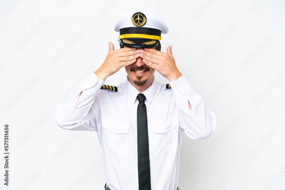 Airplane caucasian pilot isolated on white background covering eyes by hands