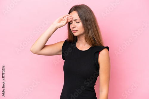 Young caucasian woman isolated on pink background with tired and sick expression