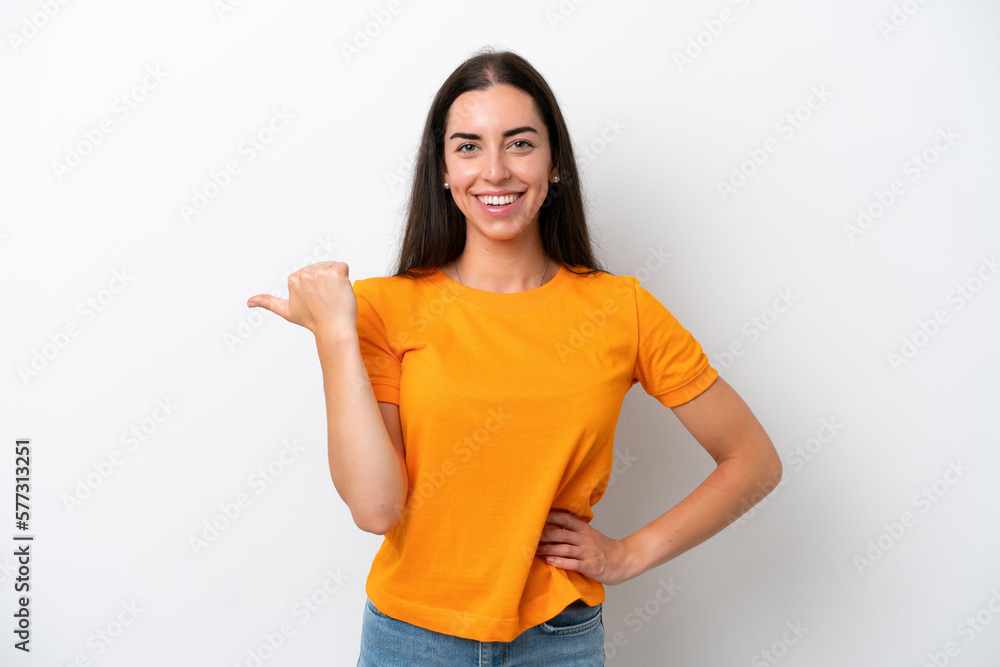 Young caucasian woman isolated on white background pointing to the side to present a product Young caucasian woman isolated on white background pointing to the side to present a product