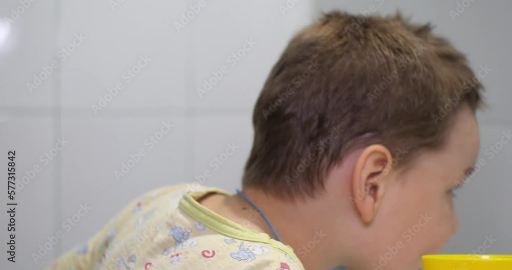 the-child-rinses-his-mouth-with-toothpaste-after-brushing-with-a