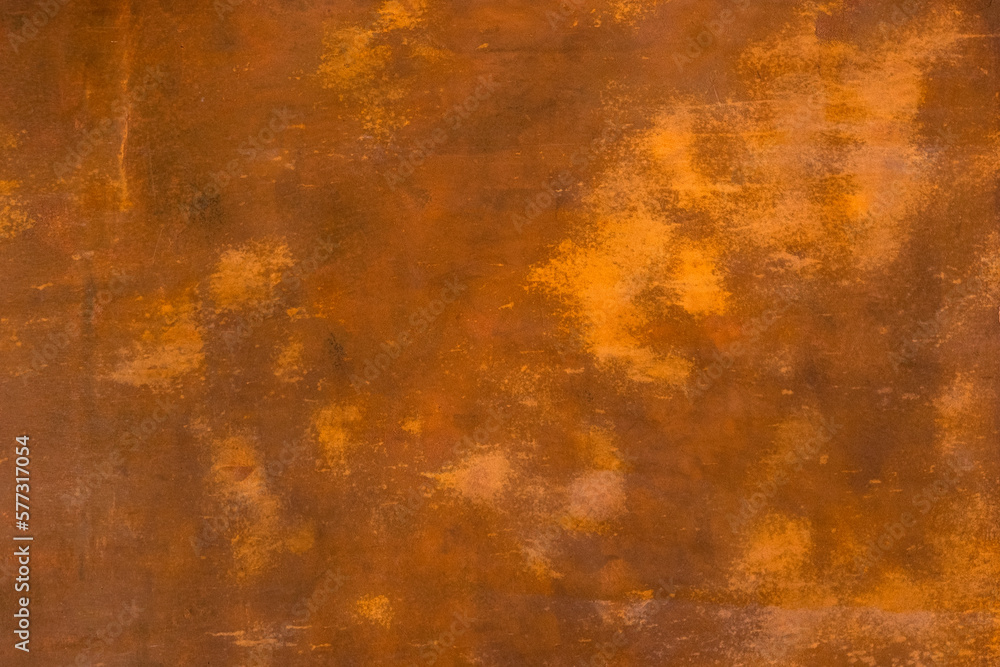 Abstract brown terracotta background with spots. Old dilapidated grudge rustic paint coating on the wall.
