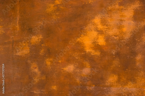 Abstract brown terracotta background with spots. Old dilapidated grudge rustic paint coating on the wall.