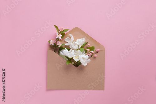 Craft envelope full of spring white fruit flowers flat lay © zakalinka