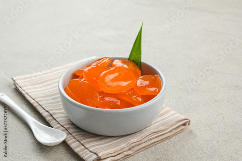 Manisan Kolang-Kaling, or preserved sugar palm fruit with orange color, Indonesian drink and dessert during the month of Ramadan. Selected focus.
 photo