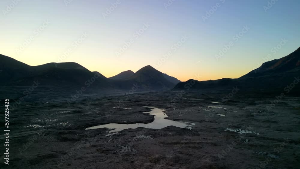 Pull away showing expansive moorland valley with Loch Caol and Cuillin mountain silhouettes at dawn at Sligachan on the Isle of Skye Scotland Pull away showing expansive moorland valley with Loch Caol and Cuillin mountain silhouettes at dawn at Sligachan on the Isle of Skye Scotland
