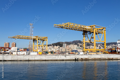 GENOA, ITALY, FEBRUARY 2, 2023 - Industrial cranes yellow colour in the port of Genoa, Italy