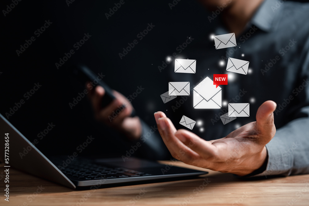 Businessman reading new email by laptop computer to customer, business contact and communication, email icon, email marketing concept, send e-mail or newsletter, online working internet network. Businessman reading new email by laptop computer to customer, business contact and communication, email icon, email marketing concept, send e-mail or newsletter, online working internet network.