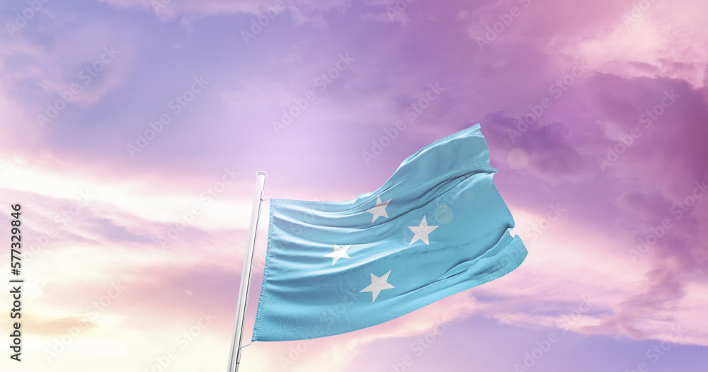 Waving Flag of Micronesia in Blue Sky. The symbol of the state on wavy cotton fabric.