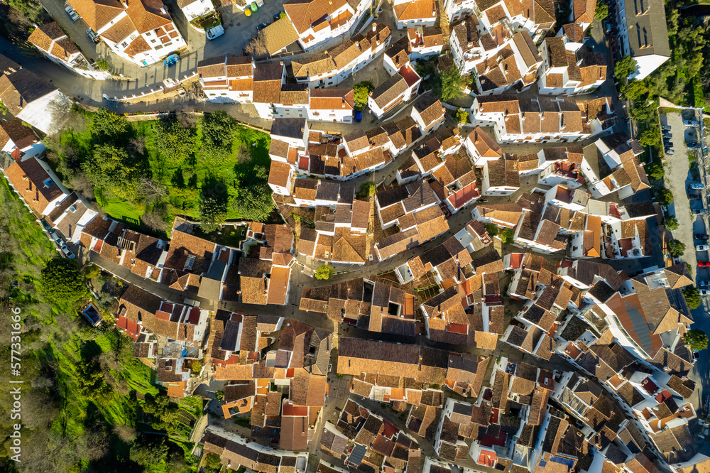 Aerial view above the beautiful white village of Genalguacil in Andalusia Spaim