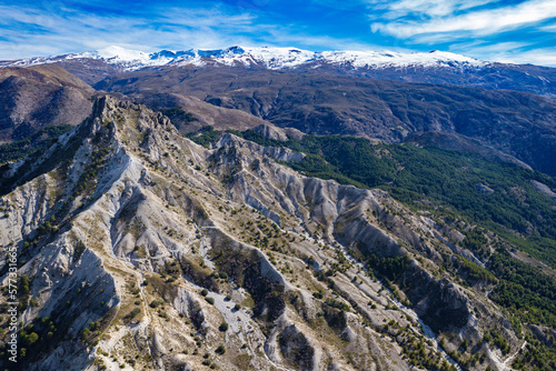 Aerial panoramic view of the mountains and valleys in the Sierra Nevada mountains in Spain 