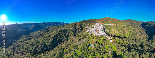 Aerial view above the beautiful white village of Genalguacil in Andalusia Spain