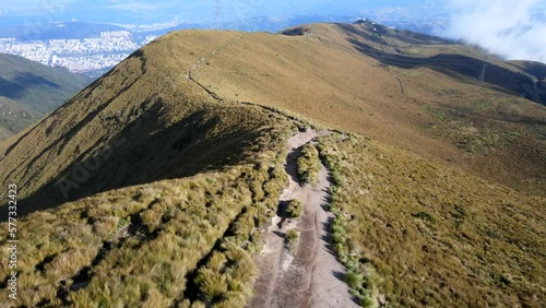 Aerial shot drone flying over mountain hiking trail leaving volcano