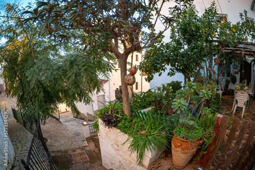 Exploring the streets of the beautiful white village of Genalguacil in Andalusia Spain at sunset during the springtime