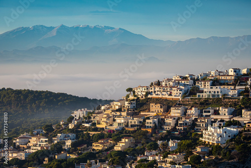 The stunning cap of f L'Escala at sunset - La Escala with the Pyrenees mountains in the background on the Costa Brava