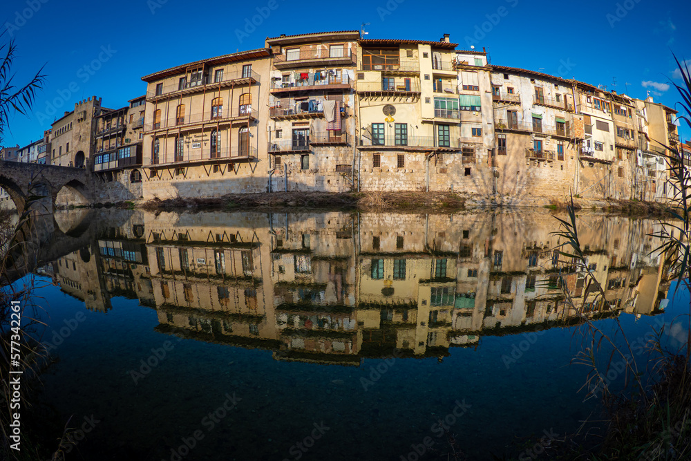Reflections of the buildung on the river in beautiful village of Valderrobres in northern Spain