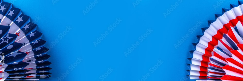 Happy Labor Day, Presidents Day, Fourth of July Independent Day, Memorial day, Columbus day background. Blue background with USA flag color paper fans and decorations, party accessories Happy Labor Day, Presidents Day, Fourth of July Independent Day, Memorial day, Columbus day background. Blue background with USA flag color paper fans and decorations, party accessories