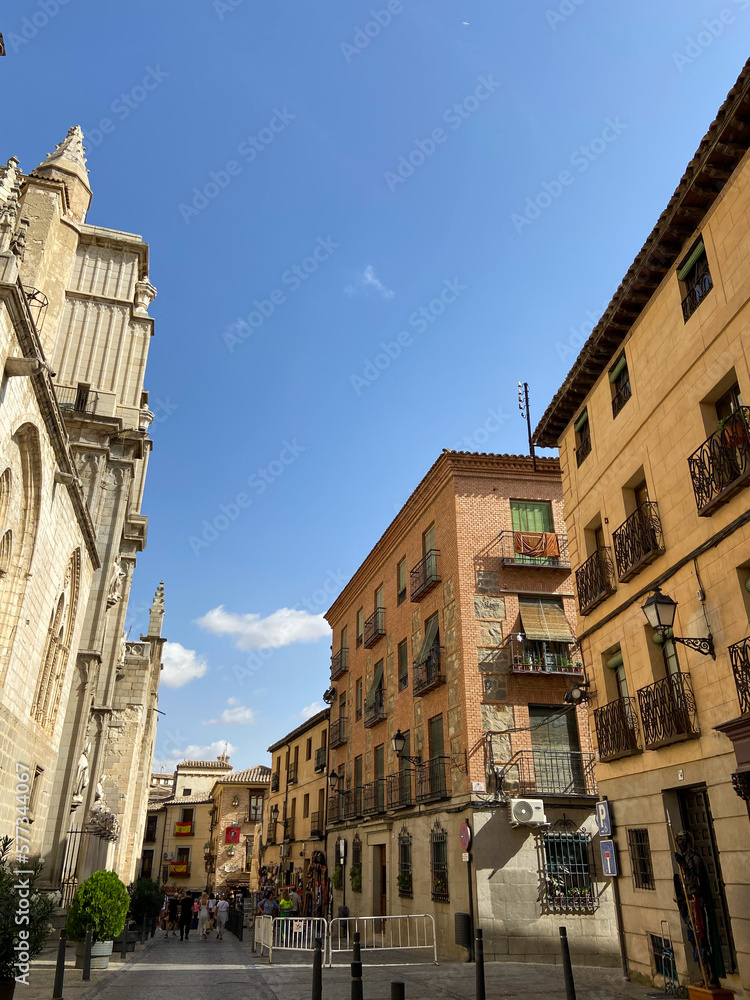 The photo captures the essence of an old-world Spanish city, with its winding streets and aged buildings. This image is perfect for those looking to showcase the beauty and history of Spain
