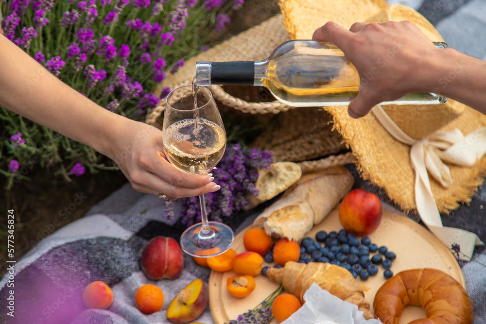 wine, fruits, berries, cheese, glasses picnic in lavender field. Selective focus wine, fruits, berries, cheese, glasses picnic in lavender field. Selective focus