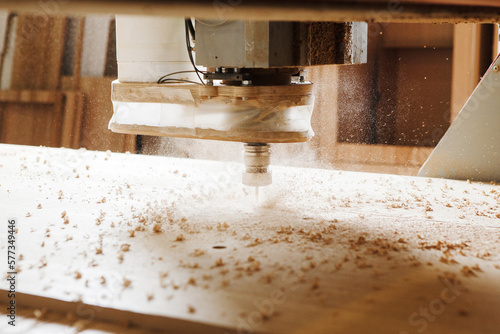 Close-up shot of machine with numerical control cuts wood. Cnc tool.