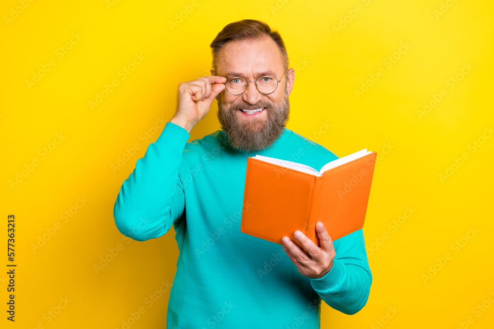 Photo portrait of attractive grandpa touch specs read writing notes professor dressed stylish cyan look isolated on yellow color background