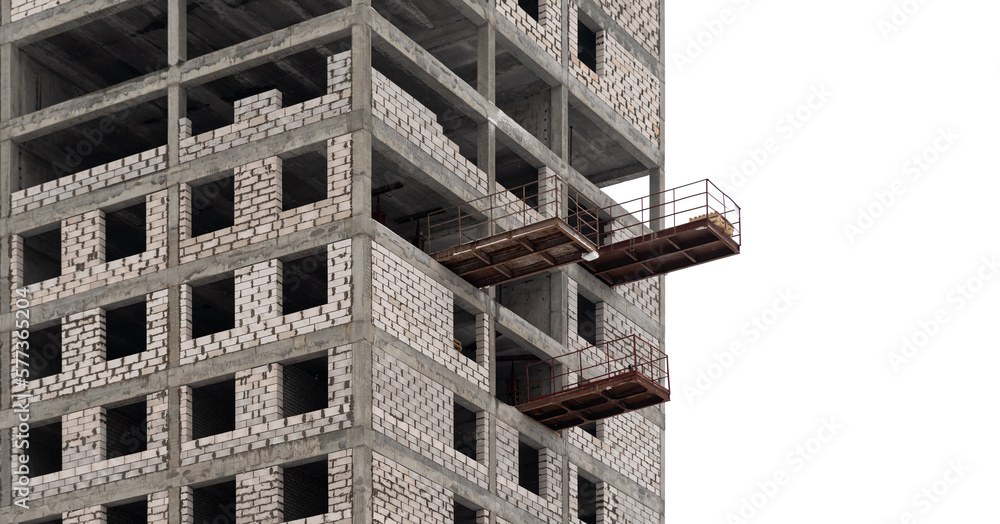 An unfinished high-rise building with scaffolding on a white isolated background.