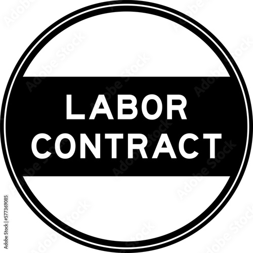 Black color round seal sticker in word labor contract on white background
