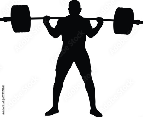 male powerlifter stand with barbell on shoulders to squatting