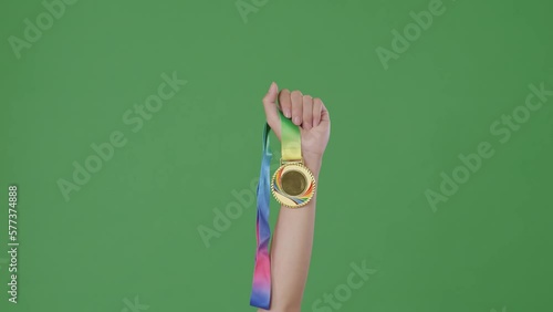 Wallpaper Mural Golden Medal In Hand. Green Screen Background
 Torontodigital.ca