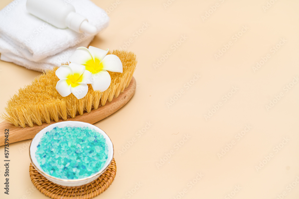 Beauty treatment items for spa procedures on beigh table. Massage brush, sea salt. copy space Beauty treatment items for spa procedures on beigh table. Massage brush, sea salt. copy space