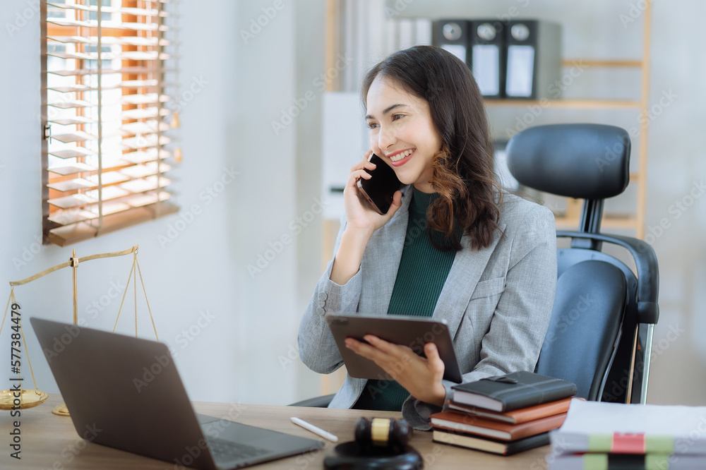 lawyers discussing contract papers sitting in the table at office in the morning. concepts of law, advice, legal services. lawyers discussing contract papers sitting in the table at office in the morning. concepts of law, advice, legal services.