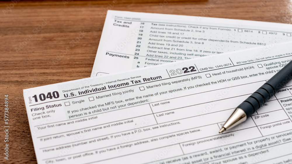 US individual Income tax return document. People have to fill the 1040 form every year to declare their income from the previous year to the Internal Revenue Service of the Department of Treasury  - obrazy, fototapety, plakaty 