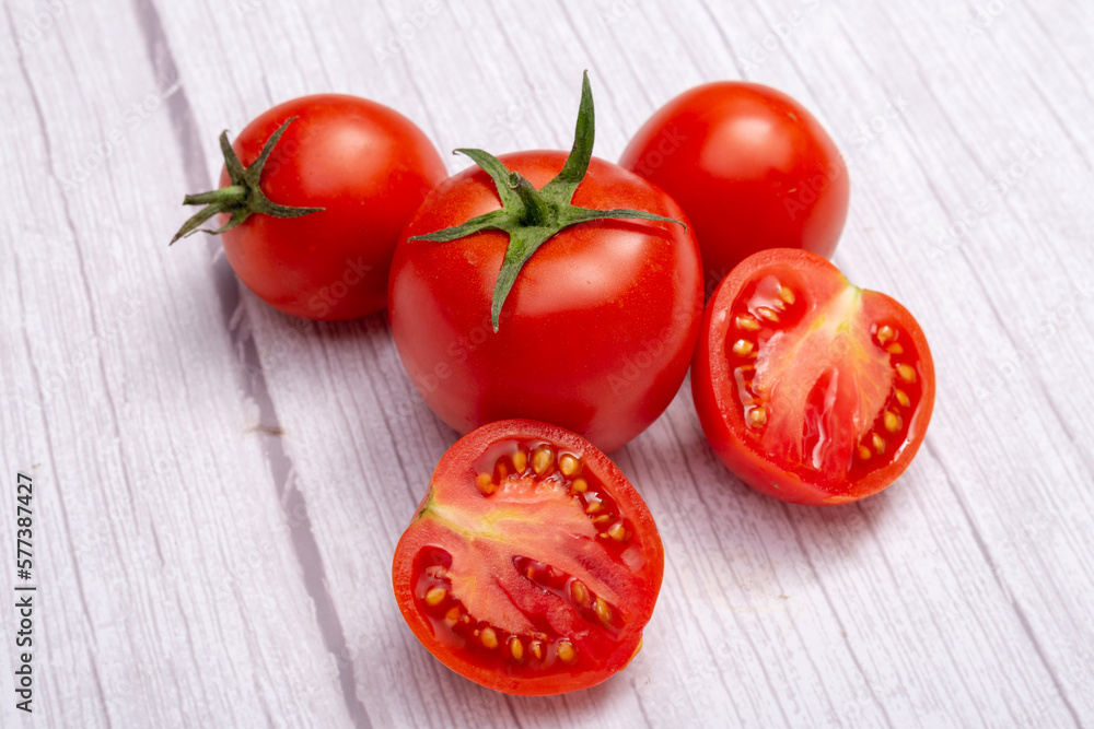 tomatoes on a wooden table tomatoes on a wooden table