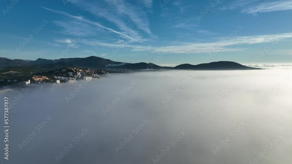 Mallorca in the fog with the town of Santa Ponca, Mallorca, Spain Mallorca in the fog with the town of Santa Ponca, Mallorca, Spain