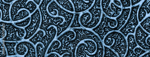 Metallic navy blue background with texture and wavy patterns. Denim backdrop of shiny textile and fabric