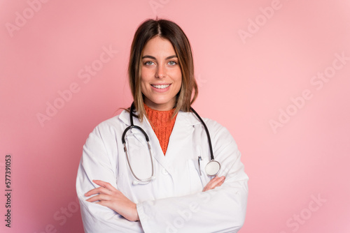 Cheerful doctor with stethoscope in studio