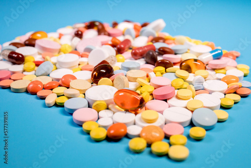 Many colorful different medicines and pills on top. The concept of medical treatment