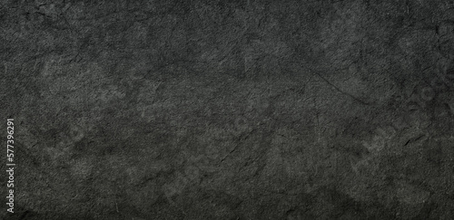 black concrete wall , grunge stone texture , dark gray rock surface background panoramic wide banner 