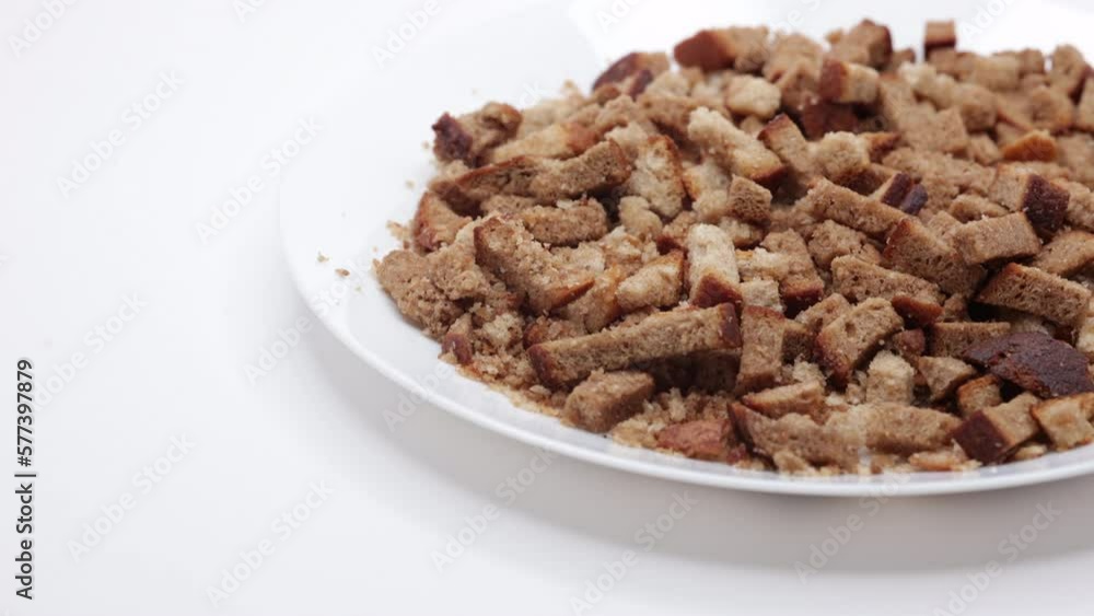 Rye Crackers In A White Plate. Bread Crispy Crackers. Breadcrumbs. Panning Dolly Slider Shot. Close Up. 4k, 60 FPS, ProRes Rye Crackers In A White Plate. Bread Crispy Crackers. Breadcrumbs. Panning Dolly Slider Shot. Close Up. 4k, 60 FPS, ProRes